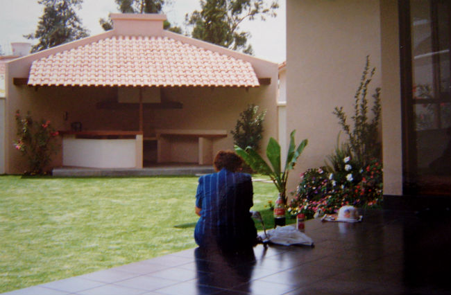 I found an old picture of our patios! We had two. Here, my lovely grandma sits underneath one and the other lies across. 