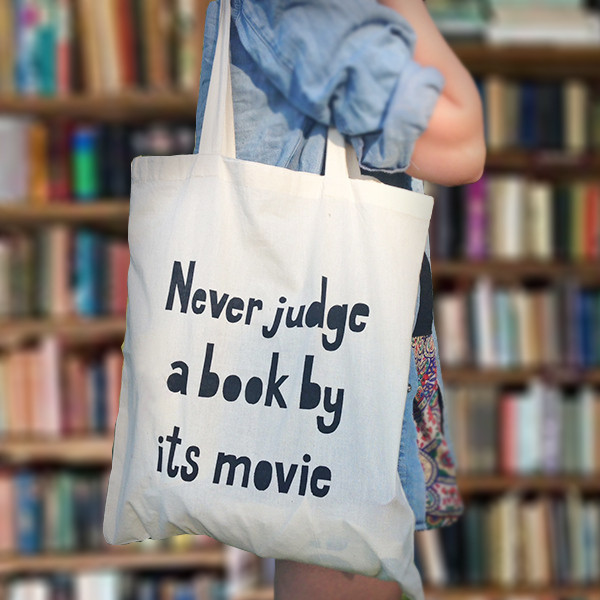 "Never Judge a Book by its Movie" tote as featured on "Gifts for Book Lovers" gift guide @homelifeabroad.com